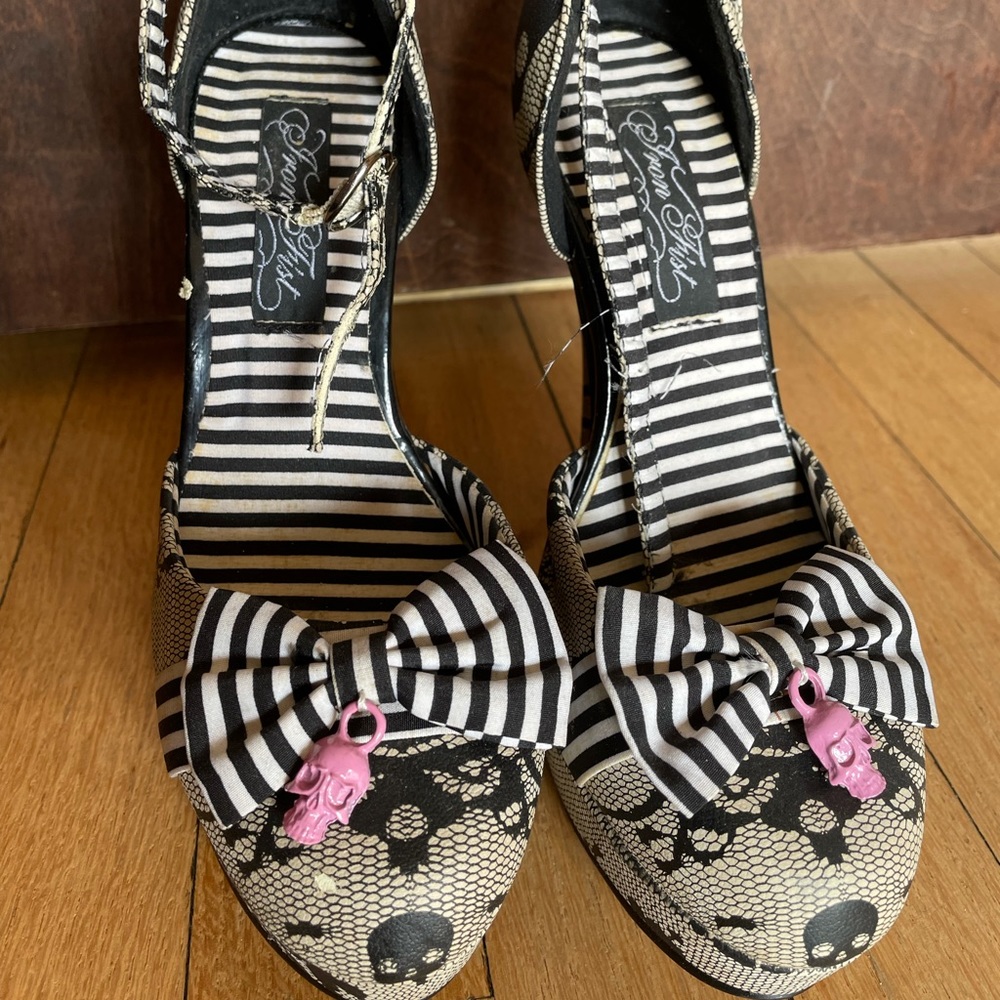 Iron fist platform heels with lace and skull detail